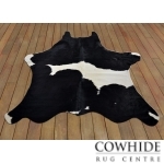 Black Cowhide Rug with Unique White Shape