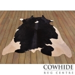 Elégant tapis en peau de vache blanc et noir
